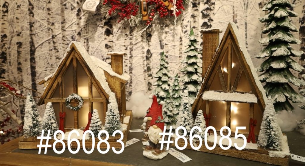 two alpine style lodge decorations with lit trees and red skis